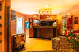 a restaurant with a bar in a room at Sole Hotel in Antananarivo