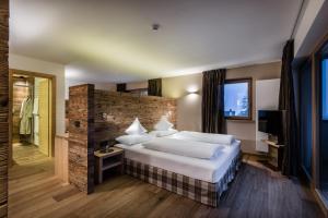 Postel nebo postele na pokoji v ubytování Hotel Christiania