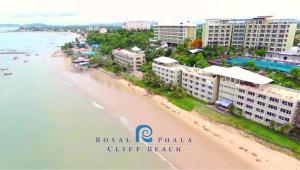 an aerial view of a beach with buildings and the ocean at Royal Phala Cliff Beach Resort in Ban Chang
