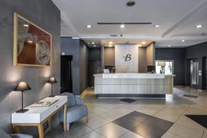 a lobby with a waiting room with a reception desk at BLEECKER Hotels in Belgrade