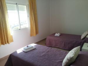 A bed or beds in a room at Vivienda vacacional La Graja