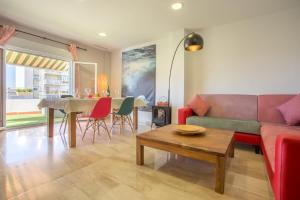a living room with a couch and a table at Atico La JOYITA free parking by Cadiz4Rentals in Cádiz