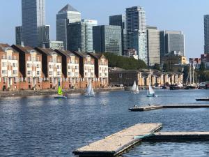 a group of sailboats on a river with a city at Double Room with Private Bathroom in a 2-bedrooms house in London