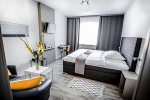 Voodi või voodid majutusasutuse Hotel Gong toas