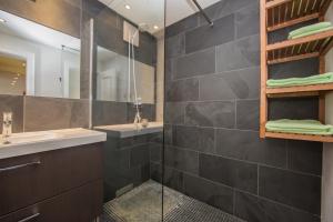 a bathroom with a sink and a shower at Apartments Anemone in Samnaun +24 photos