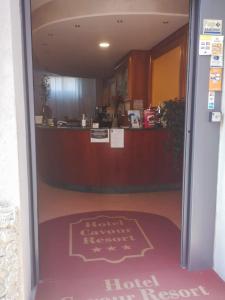 an open door to a hotel lobby with a counter at Hotel Cavour Resort in Moncalieri