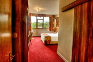 Letto o letti in una camera di West County Hotel