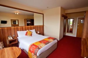 Letto o letti in una camera di West County Hotel