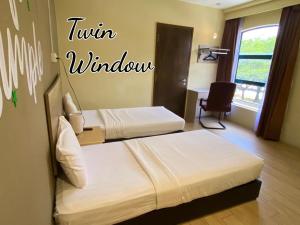 Postel nebo postele na pokoji v ubytování SH Hotel Kota Damansara