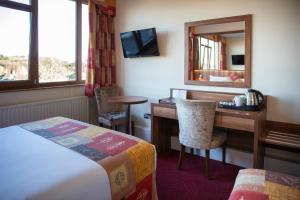 Letto o letti in una camera di West County Hotel