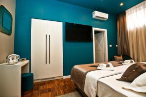 Posteľ alebo postele v izbe v ubytovaní Riva Luxury Rooms