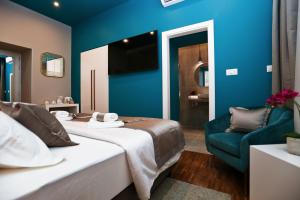Posteľ alebo postele v izbe v ubytovaní Riva Luxury Rooms