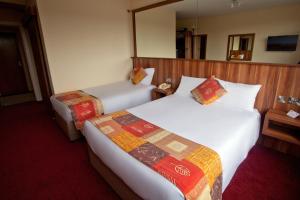 Letto o letti in una camera di West County Hotel