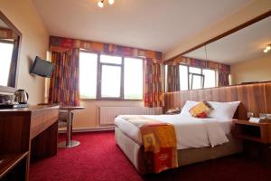 Letto o letti in una camera di West County Hotel