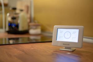 a digital clock sitting on top of a table at Palazzo D'Ambra Residenza d'Epoca in Florence