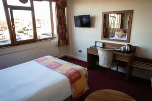 TV o dispositivi per l'intrattenimento presso West County Hotel