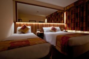 Letto o letti in una camera di West County Hotel