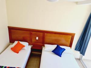 Hotel Machos Mahahual客房内的一张或多张床位