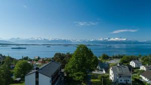 an aerial view of a town with a lake and mountains at Molde Vandrerhjem Hostel in Molde