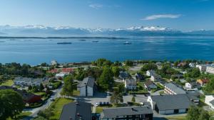 an aerial view of a town on the water with mountains at Molde Vandrerhjem Hostel in Molde