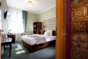 Posteľ alebo postele v izbe v ubytovaní Amber Boutique Hotels - Hotel Amber + 16 fotografií