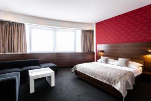 Postel nebo postele na pokoji v ubytování Tempus Club Garni Hotel + 19 fotografií