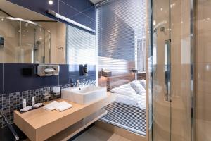 Koupelna v ubytování Tempus Club Garni Hotel
