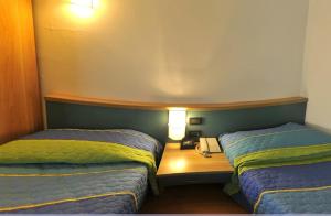 Postel nebo postele na pokoji v ubytování Hotel Vela