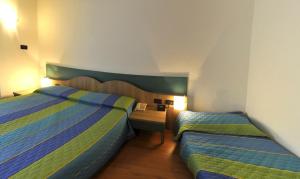 Postel nebo postele na pokoji v ubytování Hotel Vela