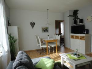 a living room with a couch and a table at Haus Sandra Ferienwohnung 2 in Dahme