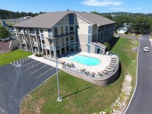 an aerial view of a building with a swimming pool at Port of Kimberling Marina & Resort in Kimberling City