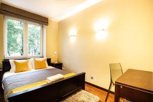 Posteľ alebo postele v izbe v ubytovaní Plac Zbawiciela Elegant Apartment