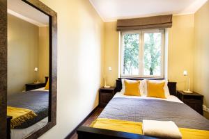 Posteľ alebo postele v izbe v ubytovaní Plac Zbawiciela Elegant Apartment