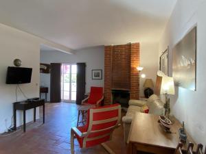 a living room with a couch and a table at Beach House - Tavira Island in Tavira