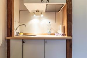 a kitchen counter with a sink and aaucet at K&S Apartments in Berlin