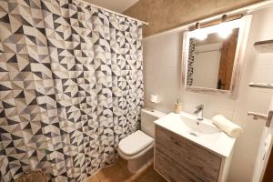 a bathroom with a toilet and a sink and a shower at Desconnectar Bellver de Cerdanya I in Bellver de Cerdanya  +6 photos
