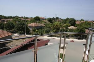 a view of a city from the balcony of a house at Hotel Akre in Kavarna