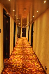 a very long hallway with a lot of stairs at Park Avenue Hotel (Near US Consulate & Sankara Nethralaya Hospital) in Chennai