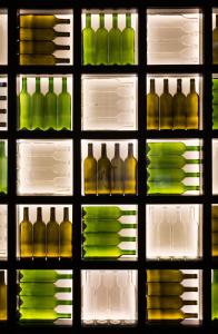 a refrigerator filled with lots of different types of wine bottles at Gallery Hostel in Porto