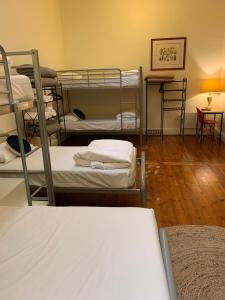 
A bunk bed or bunk beds in a room at Hotel Claremont Guest House
