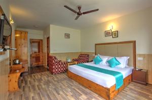 Rúm í herbergi á Hotel Mountain face by Snow City Hotels