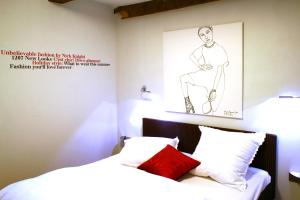 a bedroom with a drawing of a man on the wall at Haus Berghoff in Sundern