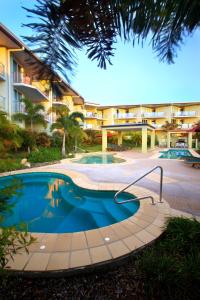 a swimming pool in front of a building at Caloundra Central Apartment Hotel Official in Caloundra
