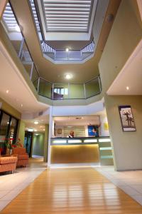 a lobby with a skylight in a building at Caloundra Central Apartment Hotel Official in Caloundra