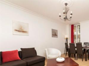 a living room with a couch and a table at Nice - Paillon apartment by Stay in the heart of ... in Nice