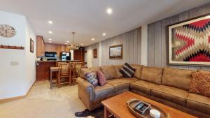 a living room with a couch and a table at Mammoth Reservations in Mammoth Lakes