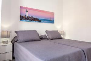 Łóżko lub łóżka w pokoju w obiekcie Apartamento Pizarro 1b