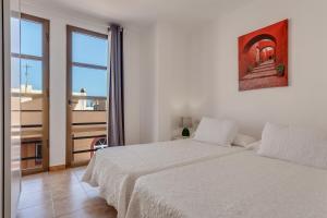 Posteľ alebo postele v izbe v ubytovaní Apartamento Pizarro 2b