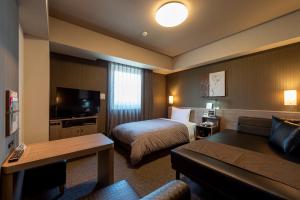 TV a/nebo společenská místnost v ubytování Hotel Route-Inn Kanuma Inter