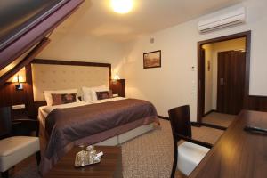 Posteľ alebo postele v izbe v ubytovaní Hotel Sladovna